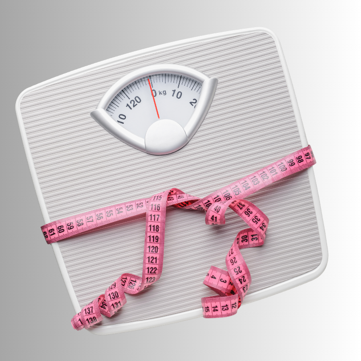 Weight scale with a pink measuring tape on a white background